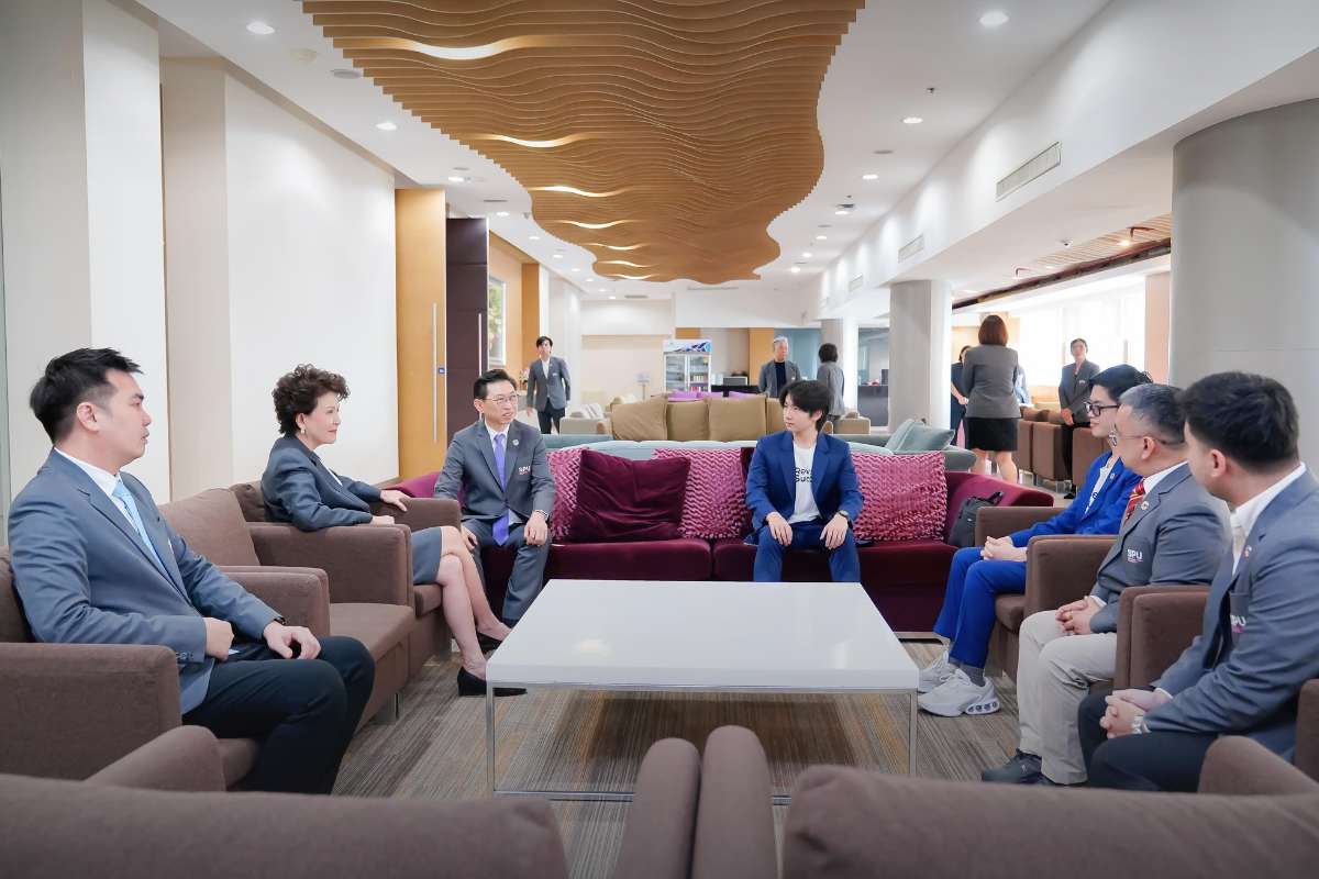 RevisionSuccess and Sripatum University teams in conversation following the MOU signing